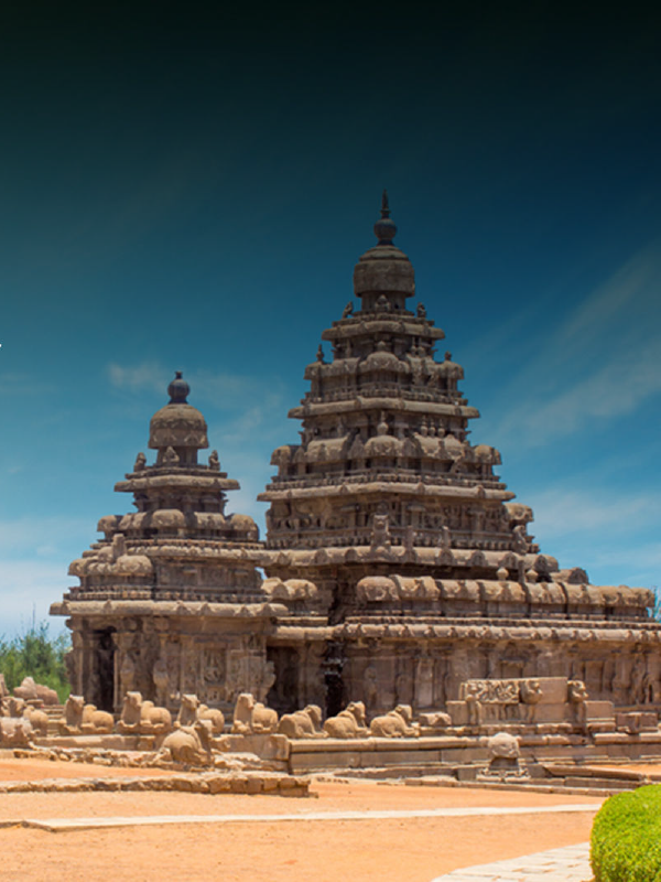 "Majestic view of a traditional South Indian temple with intricate carvings and towering gopurams."